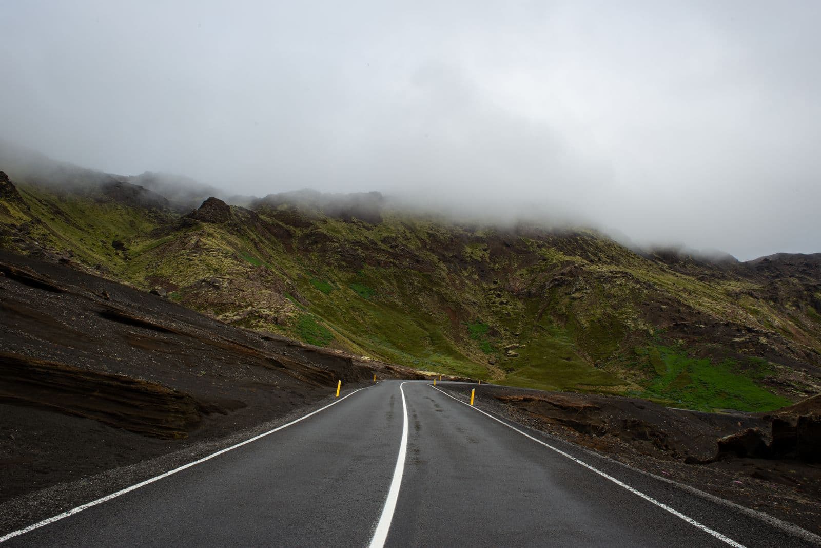 Misty green Icelandic hillside with soft rolling hills and calm atmosphere
