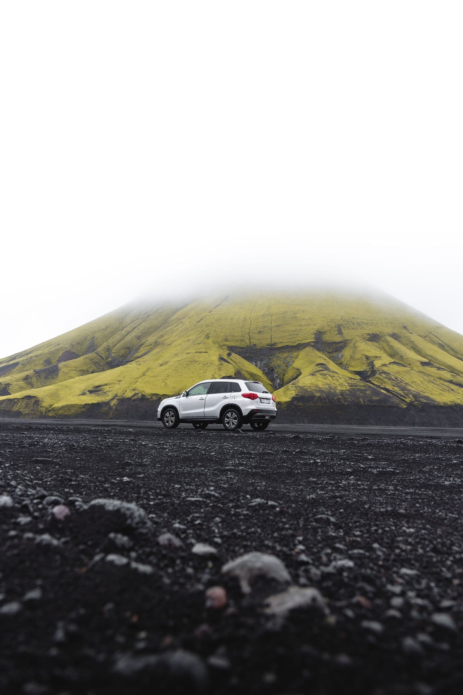 An all-wheel-drive SUV on an Icelandic gravel road